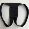 Product image of the STP harness. It looks like a black jock strap, but has no wasitband (it loops around the legs). There are smaller loops above and below the hole where the packer sticks through, to hold the shaft in place.